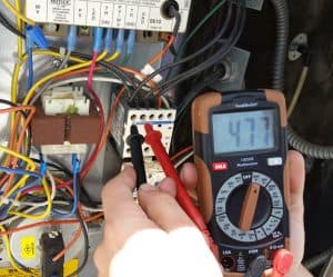 electrician testing electrical current Voltz Electrical Service Augusta GA