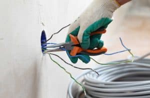 electrical wiring with safety gloves Voltz Electrical Service Augusta GA